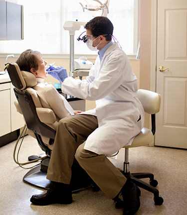 Dental  Dental Coverage provided as a dentist works on a patient