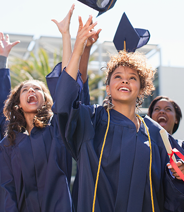 Student Loan Match Repayment Graduating from college throwing her cap in the air